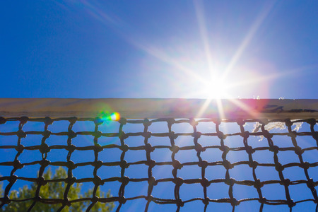 Tennis net on blue skyの写真素材