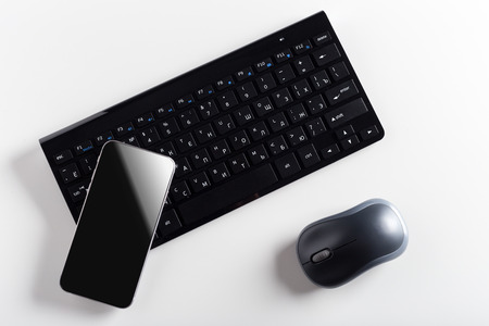 keyboard with mobile phone on the table