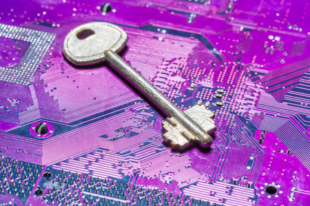 Close up of key on computer circuit boardの写真素材