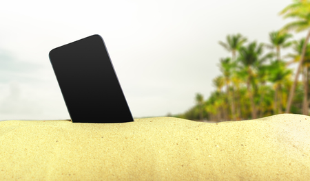 Phone on the sandの写真素材