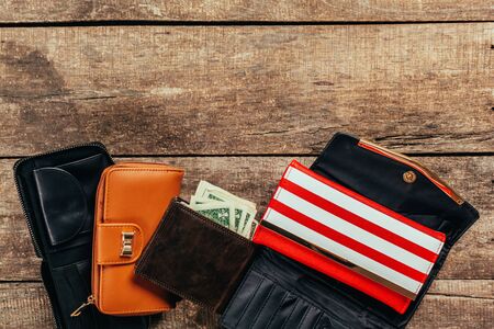 Wallets on wooden background