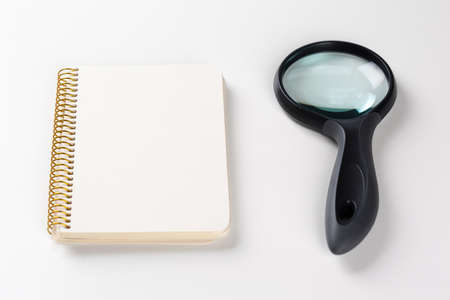 notebook and magnifying glass.research ideaの写真素材