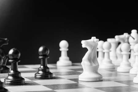 Chess pieces set on a chessboard