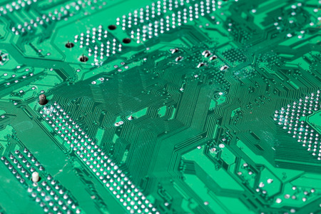 Close up of a printed green computer circuit boardの写真素材