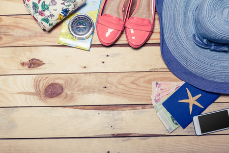 Accessories for travel. Passport, photo camera and travel map. Top view.の写真素材