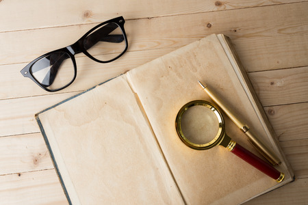 Magnifying glass and bookの写真素材