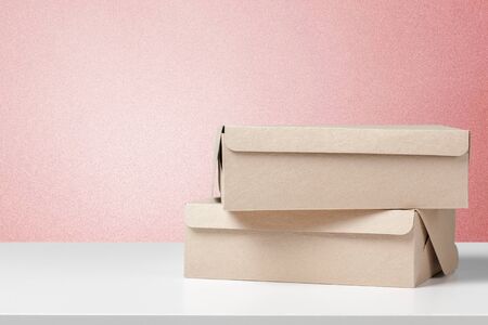 cardboard boxes on white deskの写真素材