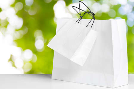 Shopping Bag of presents on white table.の写真素材