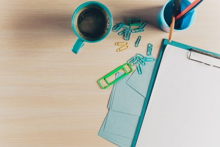 Top view workspace with blank notebook and pen on wooden tableの写真素材