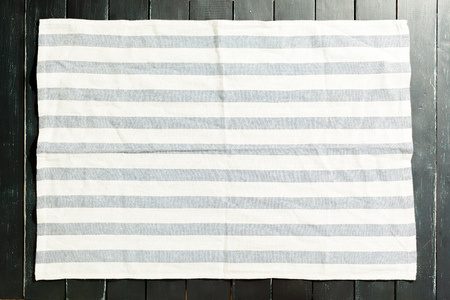 tablecloth on black wooden tableの写真素材