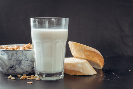 glass of milk and breadの写真素材