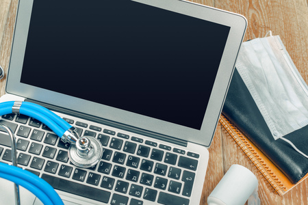 Stethoscope on laptop, close-upの写真素材