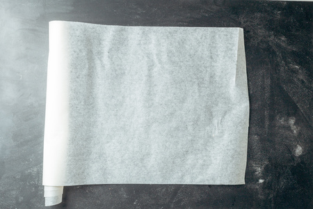 Baking paper on wooden kitchen tableの写真素材