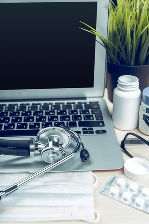 Stethoscope on laptop, close-upの写真素材