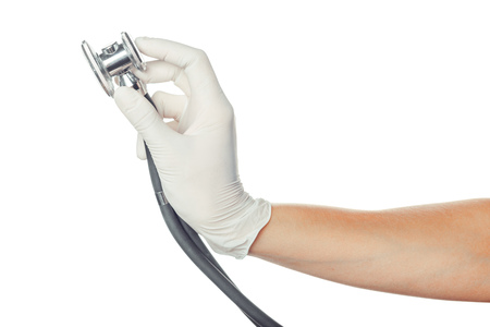 doctor's hand in white sterilized surgical glove with stethoscopeの写真素材