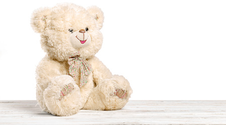 Teddy Bear toy alone on woodの写真素材
