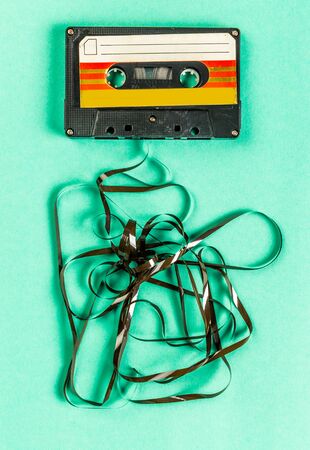 Old audio cassettes on turquoise backgroundの写真素材
