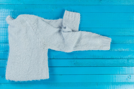 Stack of cozy knitted sweatersの写真素材