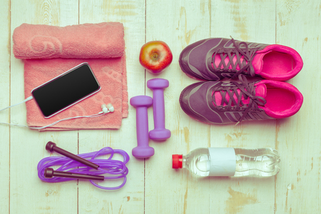 Sport stuff on wooden table, top viewの写真素材