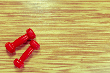 Sports equipment on wooden floorの写真素材