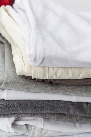 Stack of clothes on white background, closeupの写真素材