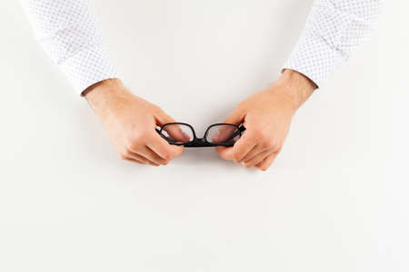 Glasses in hand.の写真素材