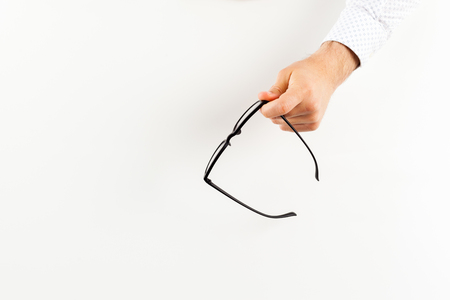 Glasses in hand.の写真素材