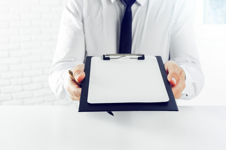 Clipboard on a white table. close upの写真素材