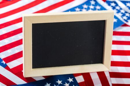 Blank chalk board with American Flagの写真素材