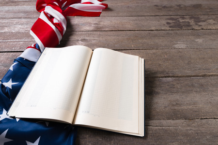 open book on American flagの写真素材