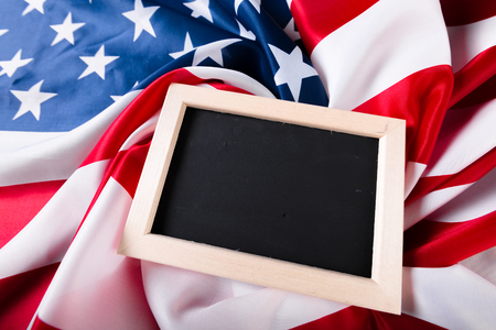 Blank chalk board with American Flagの写真素材