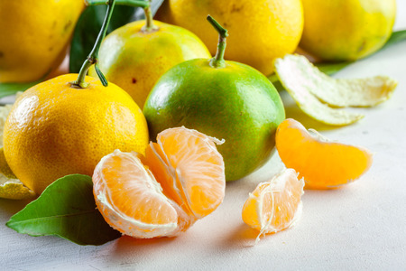 Ripe mandarin with leavesの写真素材