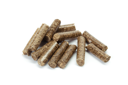 stack of wooden pellets for bio energy, white background, isolated