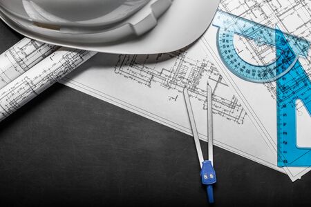 Construction planning drawings on black background