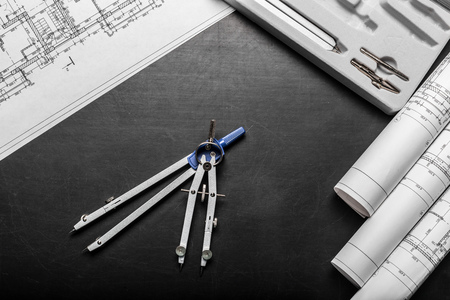 Construction planning drawings on black background