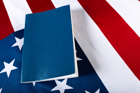 Bible laying on top of an american flag