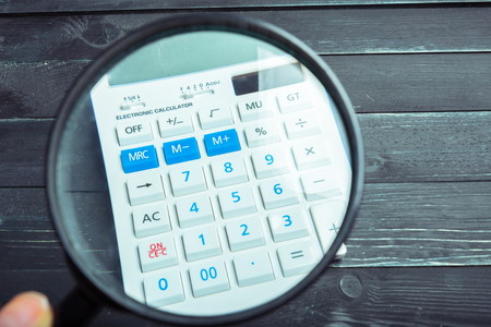 Calculator and magnifying glassの写真素材