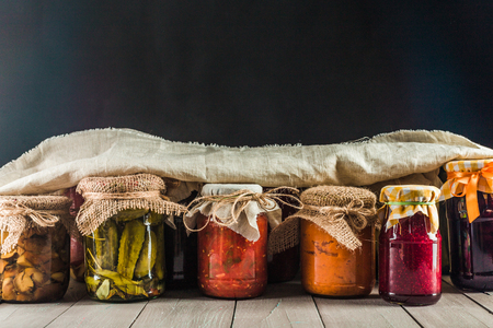 Preserved vegetables on wooden backgroundの写真素材