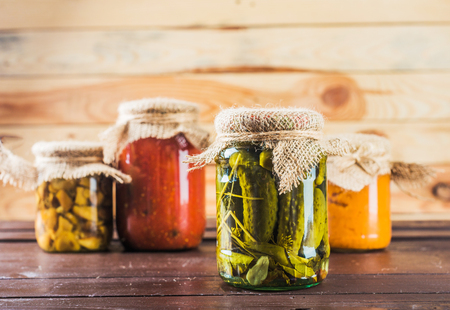 Preserved vegetables on wooden backgroundの写真素材