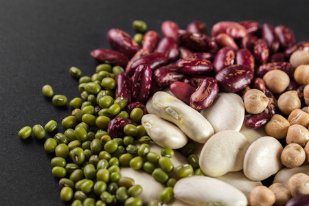 mix of beans on wooden tableの写真素材