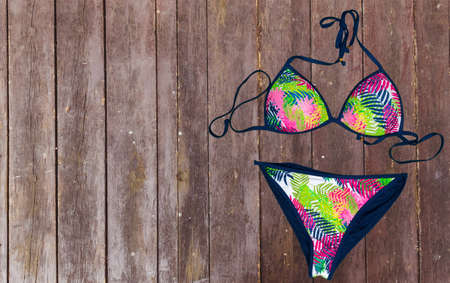 swimsuit on wooden background. top viewの写真素材