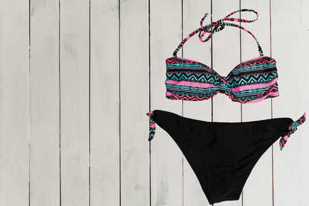 swimsuit on wooden background. top viewの写真素材