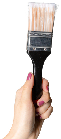 Woman hand with paint brush with plastic black handle isolated on a white backgroundの写真素材