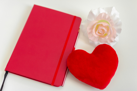 Red heart and notebookの写真素材