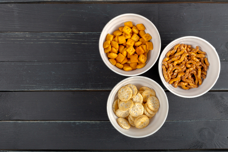 Pretzels in bowls on wooden table from aboveの写真素材