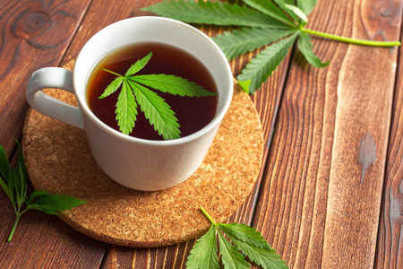 Cannabis herbal tea and marijuana leavesの写真素材