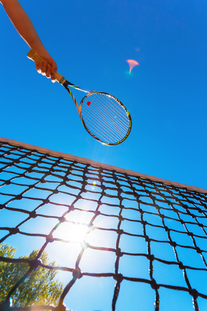 Tennis net on blue skyの写真素材