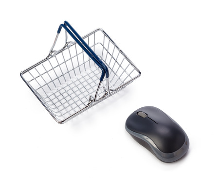 Computer mouse and shopping basketの写真素材