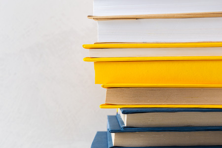 pile of paperback books on a tableの写真素材