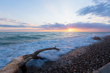 Sea surf on a stony beach.の写真素材